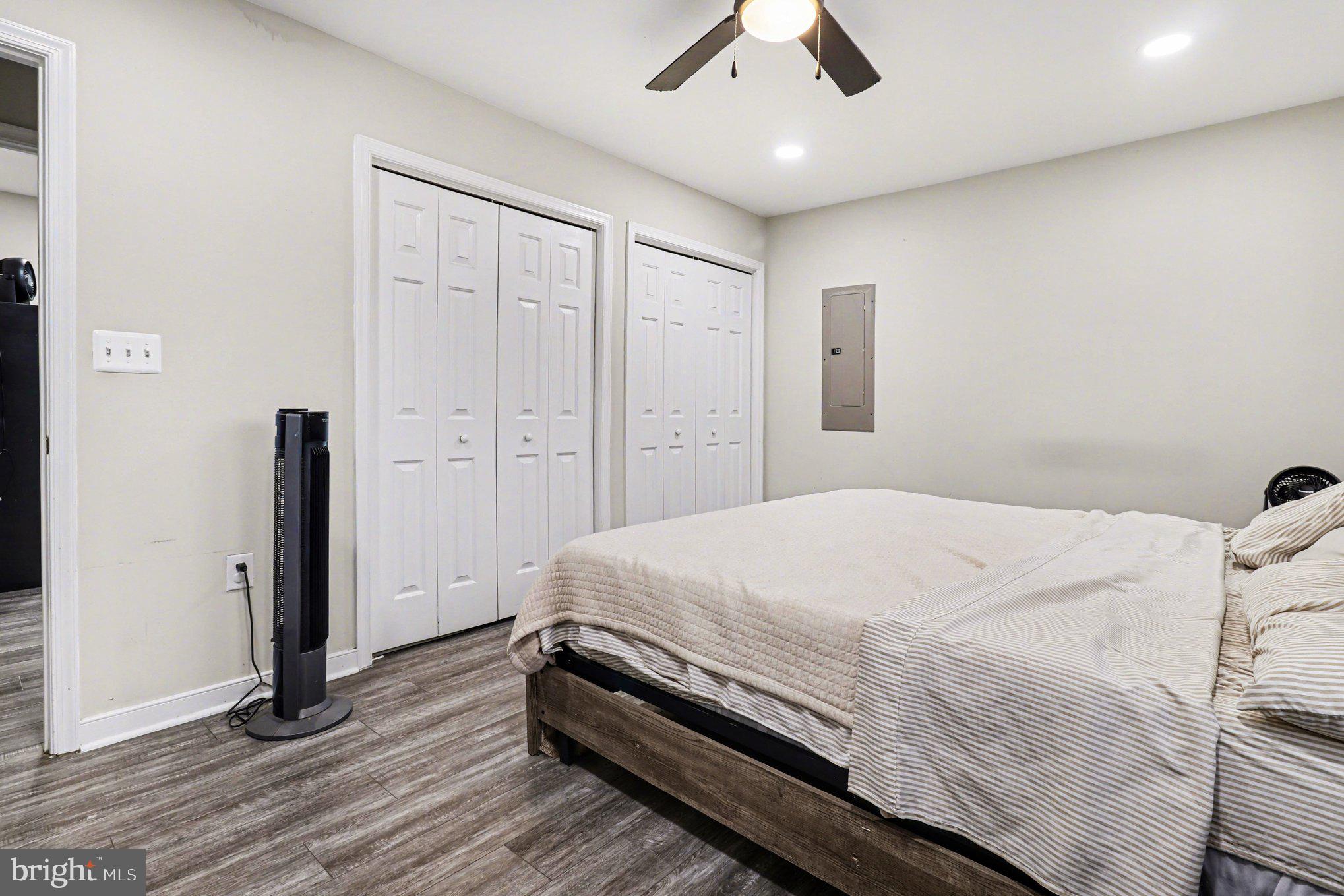 2225 Partlow Road Beaverdam, VA 23015 - Photo 16 of 27 a bedroom with a bed and a chandelier