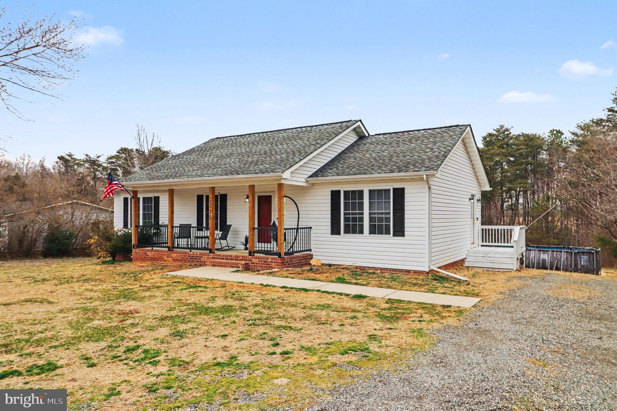 2225 Partlow Road Beaverdam, VA 23015 - Photo 2 of 27 a front view of house with yard outdoor seating and barbeque oven