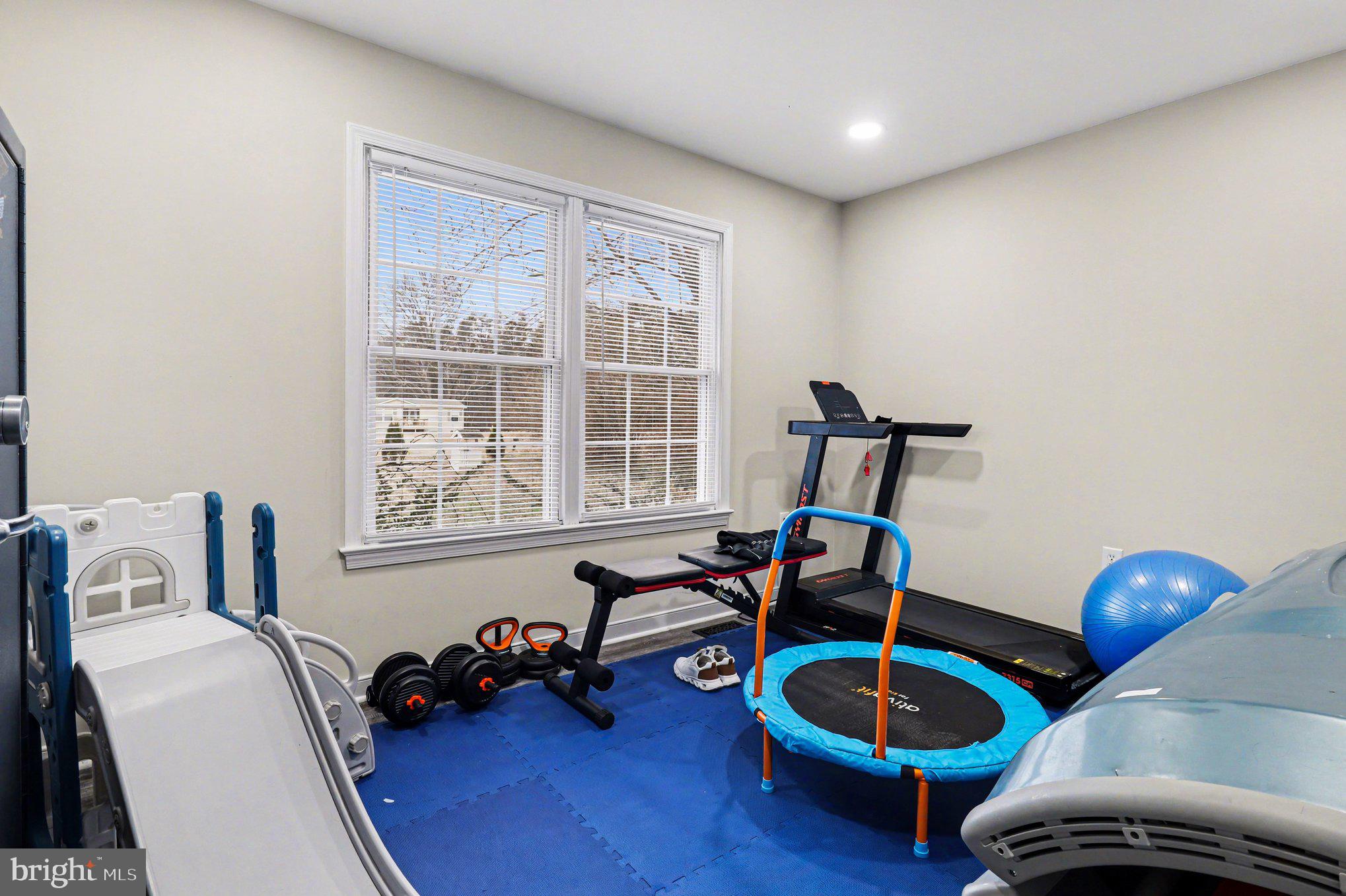 2225 Partlow Road Beaverdam, VA 23015 - Photo 23 of 27 a room with furniture and a wooden floor