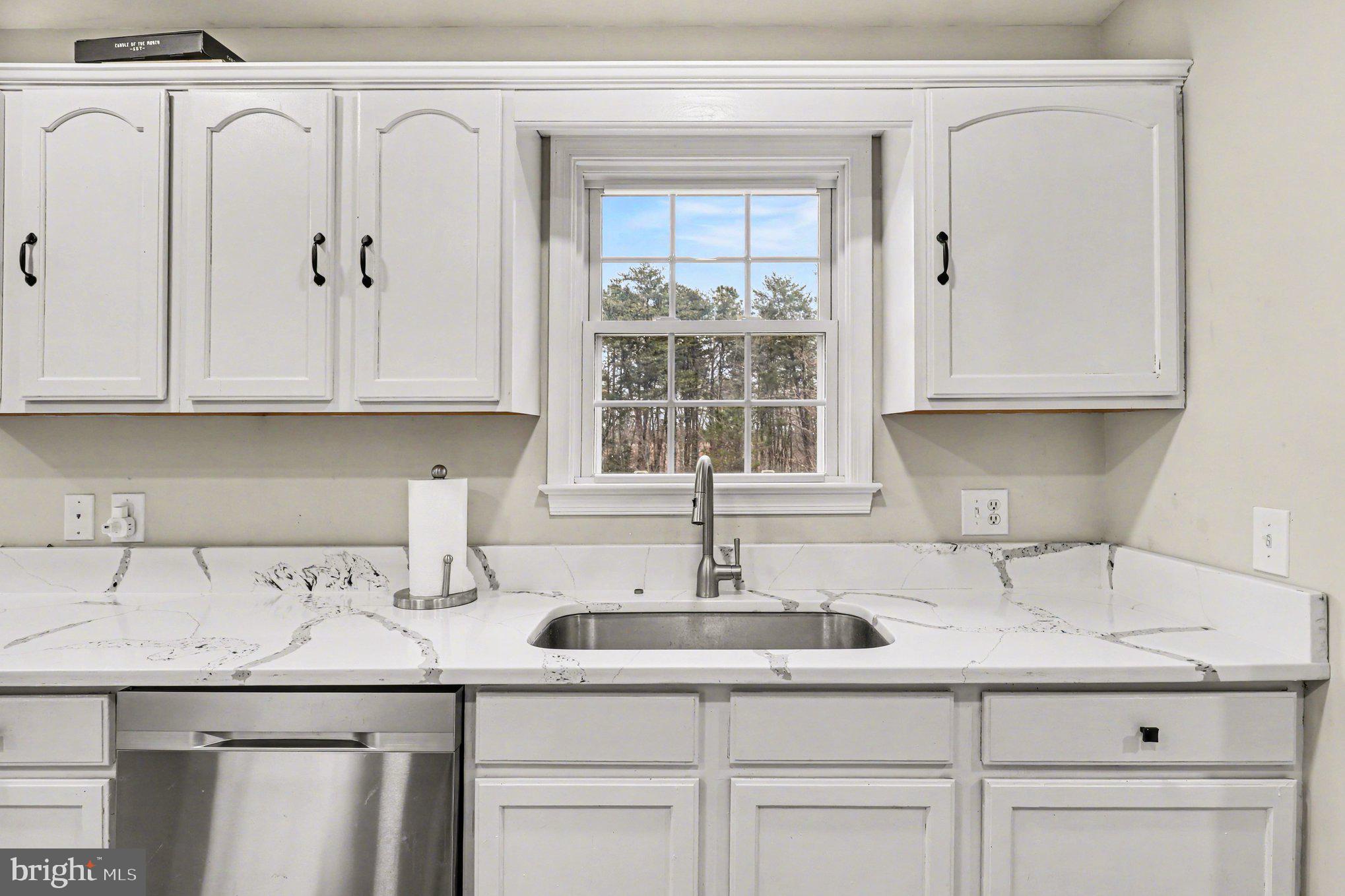 2225 Partlow Road Beaverdam, VA 23015 - Photo 7 of 27 a kitchen with white cabinets and a sink