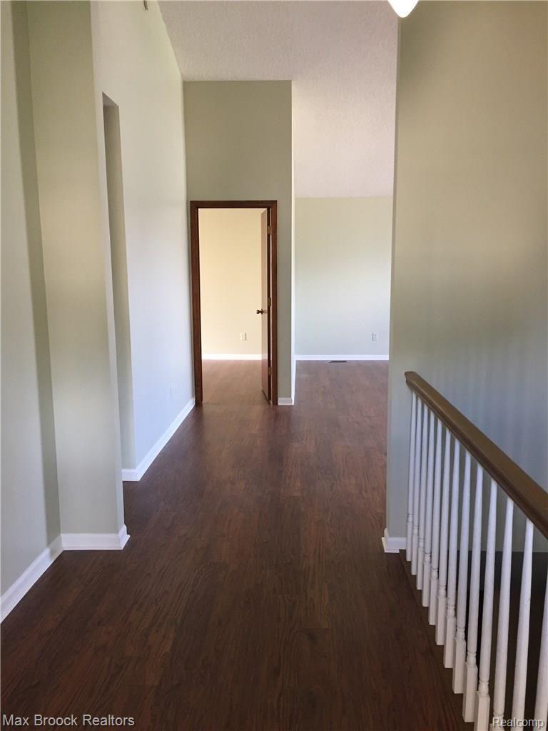 21990 River Ridge Trail, Unit 70 Farmington, MI 48335 - Photo 9 of 27 New Pergo flooring; freshly painted interior