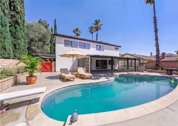 a view of a house with swimming pool