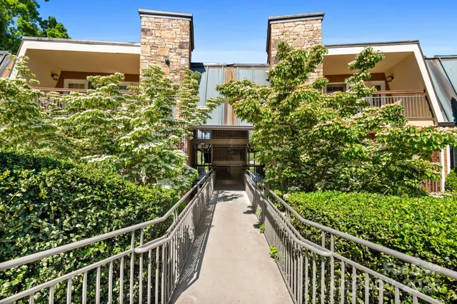 a balcony with next to a yard