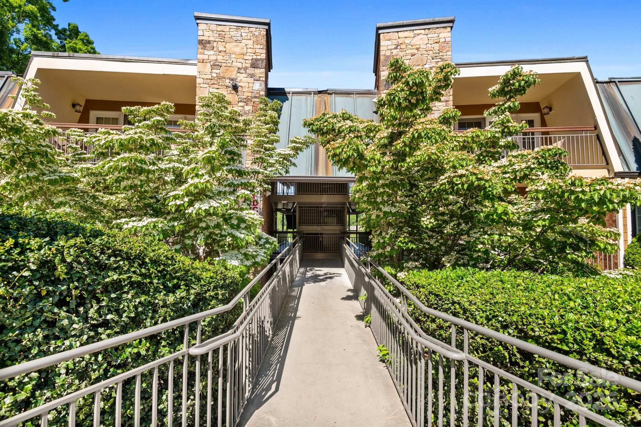 a balcony with next to a yard