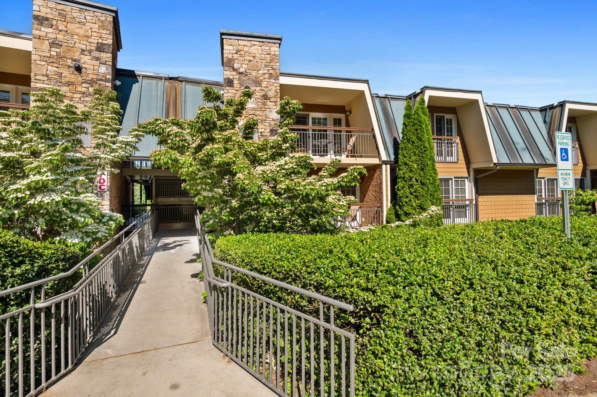 203 Bowling Park Road Asheville, NC 28803 - Photo 2 of 23 a view of a house with brick walls