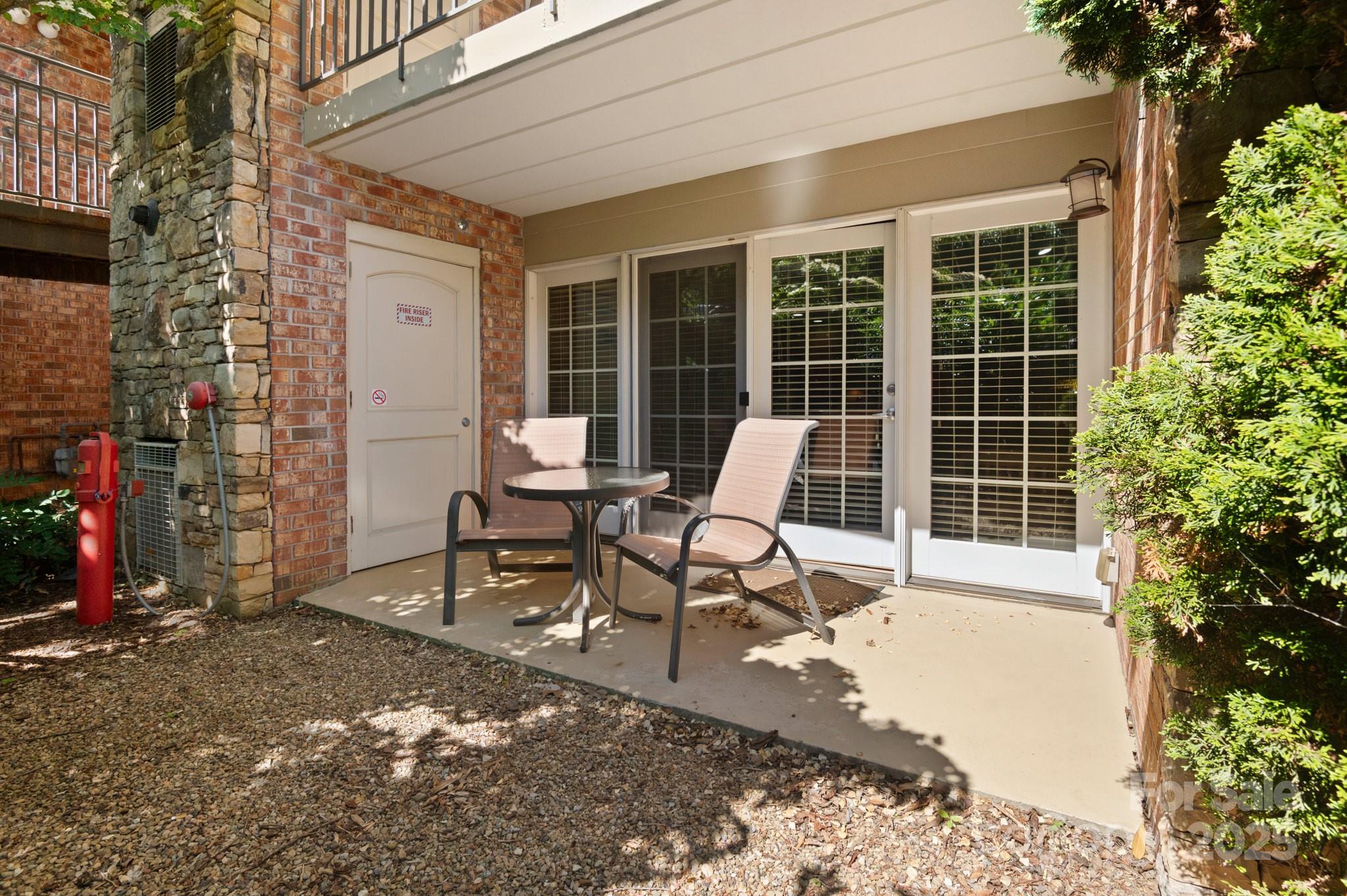 203 Bowling Park Road Asheville, NC 28803 - Photo 22 of 23 a view of a lounge chair in the front of a house