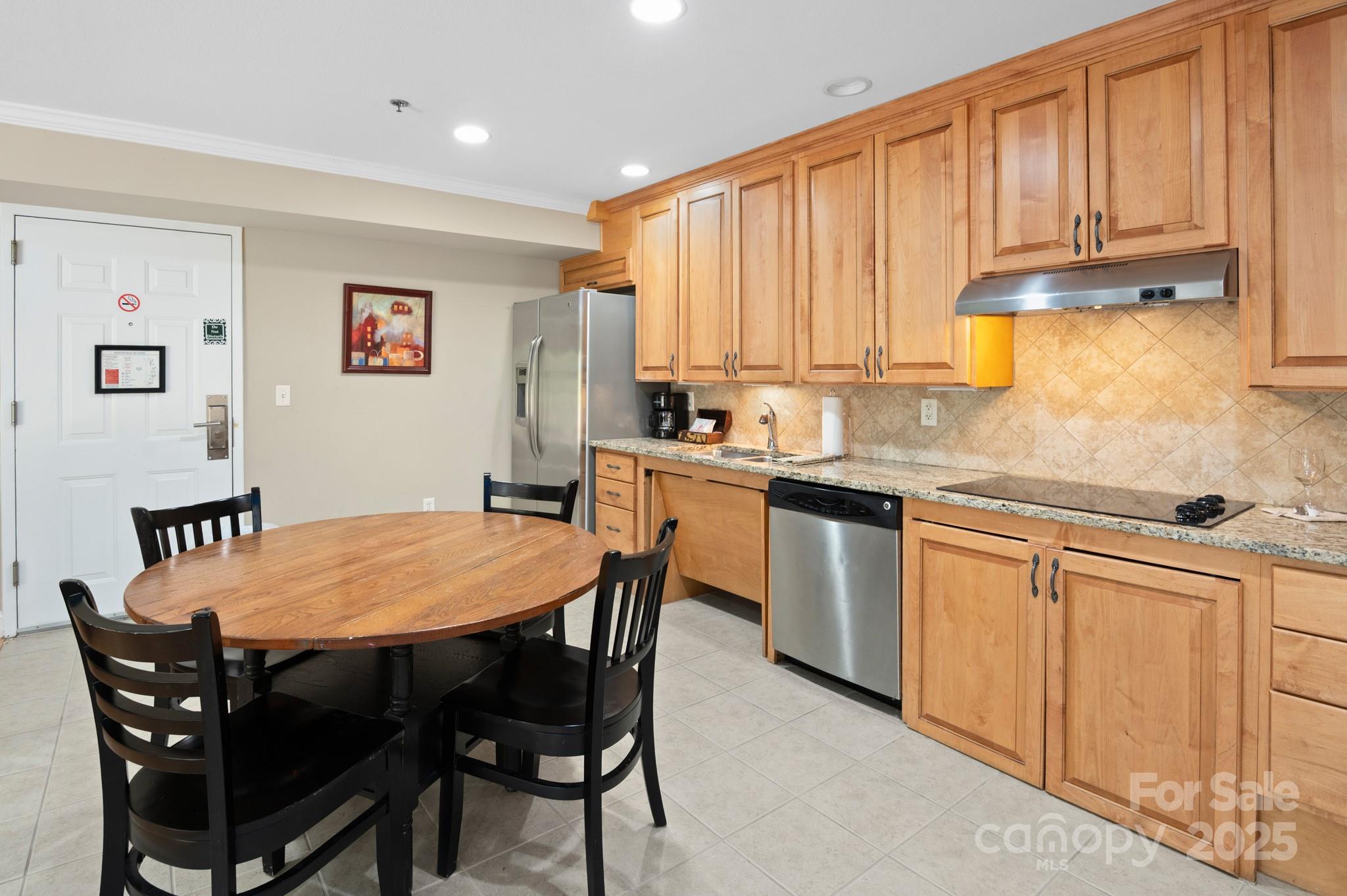 203 Bowling Park Road Asheville, NC 28803 - Photo 5 of 23 a view of a dining room with furniture and a window