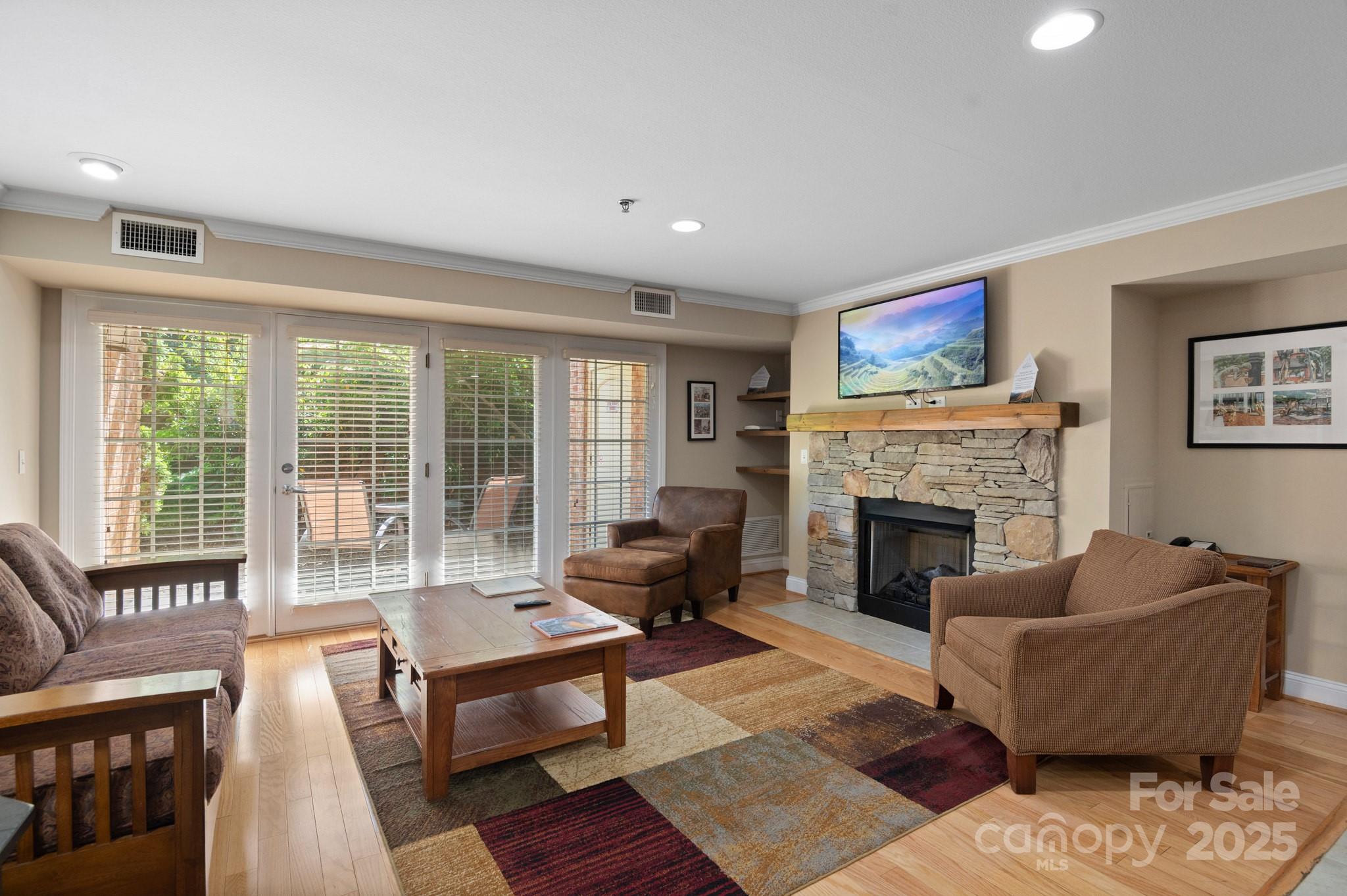 203 Bowling Park Road Asheville, NC 28803 - Photo 6 of 23 a living room with furniture and a fireplace