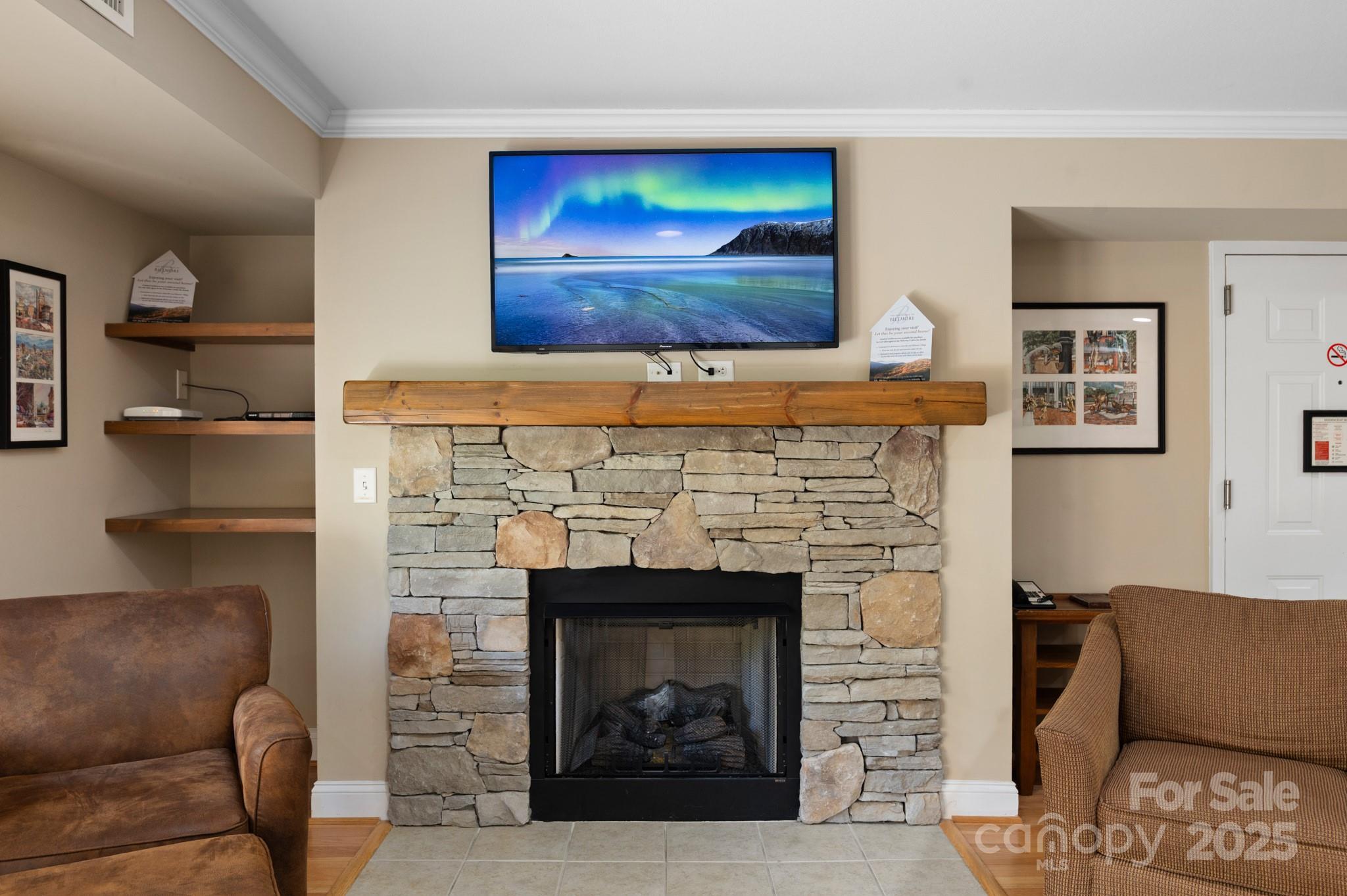 203 Bowling Park Road Asheville, NC 28803 - Photo 8 of 23 a living room with furniture and a fireplace