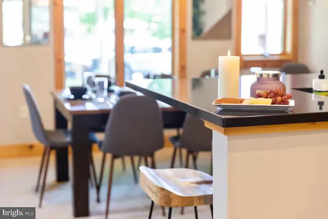 a view of a dining room with furniture window and outside view