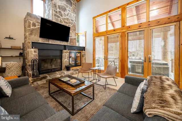 a view of a patio with a table chairs and backyard