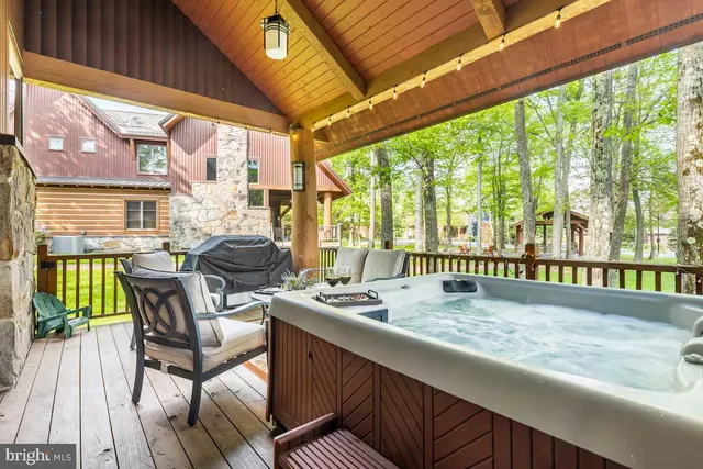 a bedroom with a large bed and a dresser