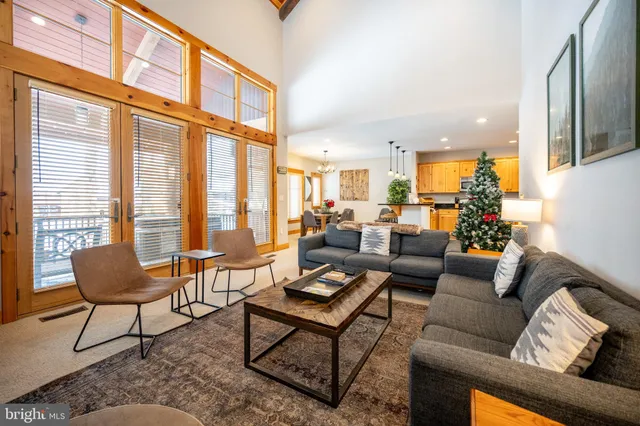 a living room with fireplace furniture and a flat screen tv