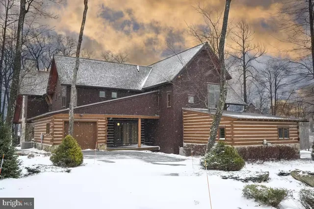 a bedroom with a bed and flat screen tv