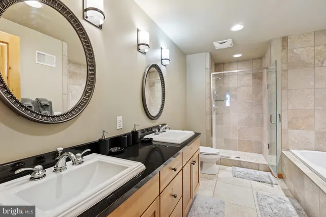 a kitchen with stainless steel appliances granite countertop a stove and a refrigerator