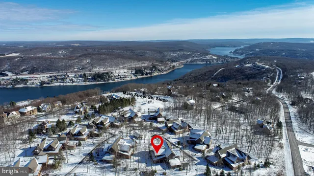 a bedroom with a bed a couch and a window