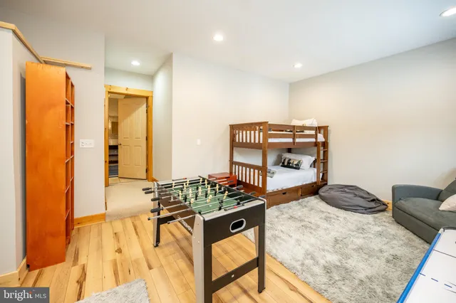 a bedroom with a bed and a television