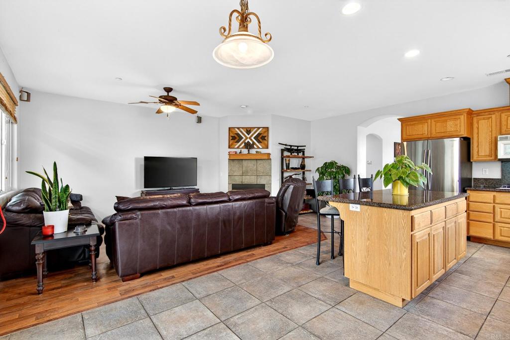 15953 Shalom Road Ramona, CA 92065 - Photo 18 of 71 a living room with furniture and a flat screen tv