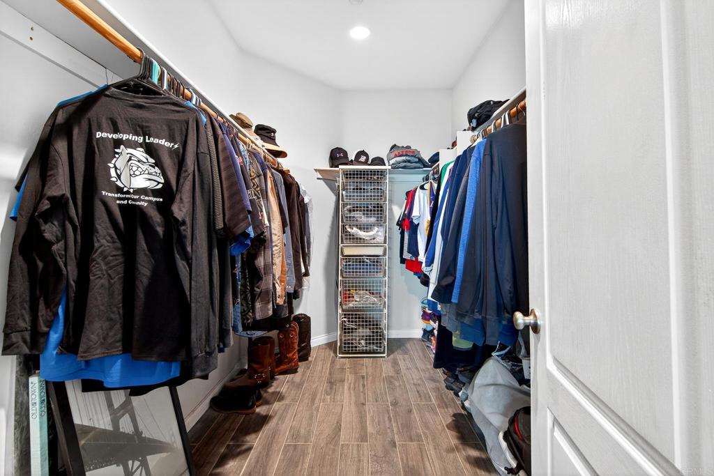 15953 Shalom Road Ramona, CA 92065 - Photo 29 of 71 a view of walk in closet with clothes and shoes