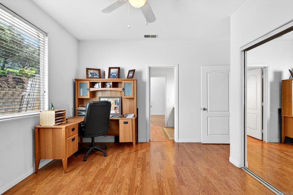 15953 Shalom Road Ramona, CA 92065 - Photo 33 of 71 a view of a workspace with furniture and a bedroom