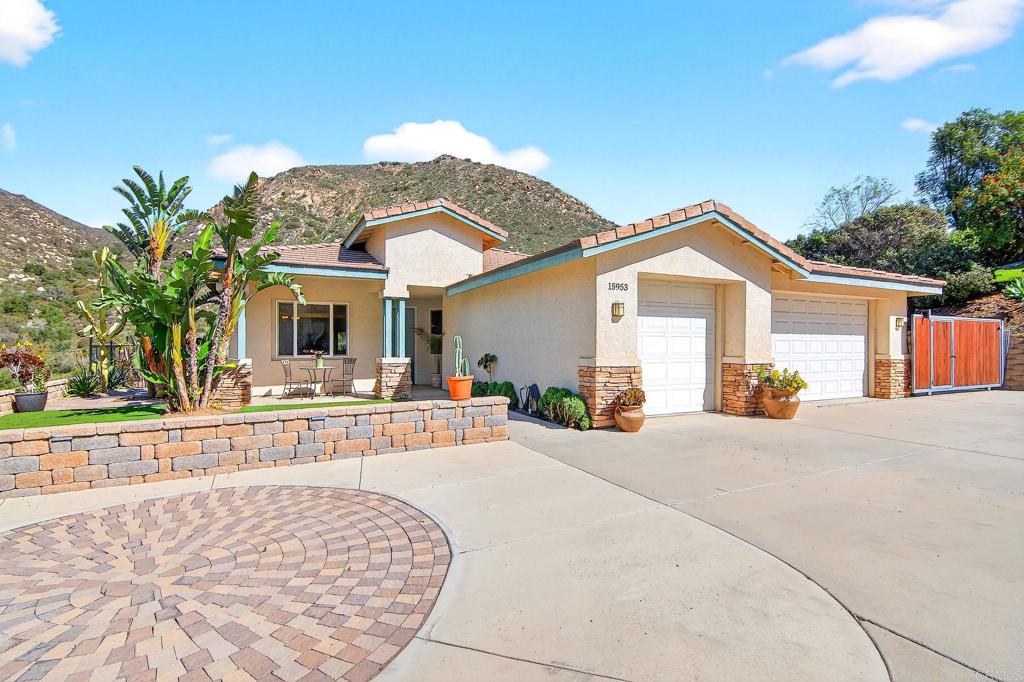 15953 Shalom Road Ramona, CA 92065 - Photo 4 of 71 a view of a house with a small yard and plants