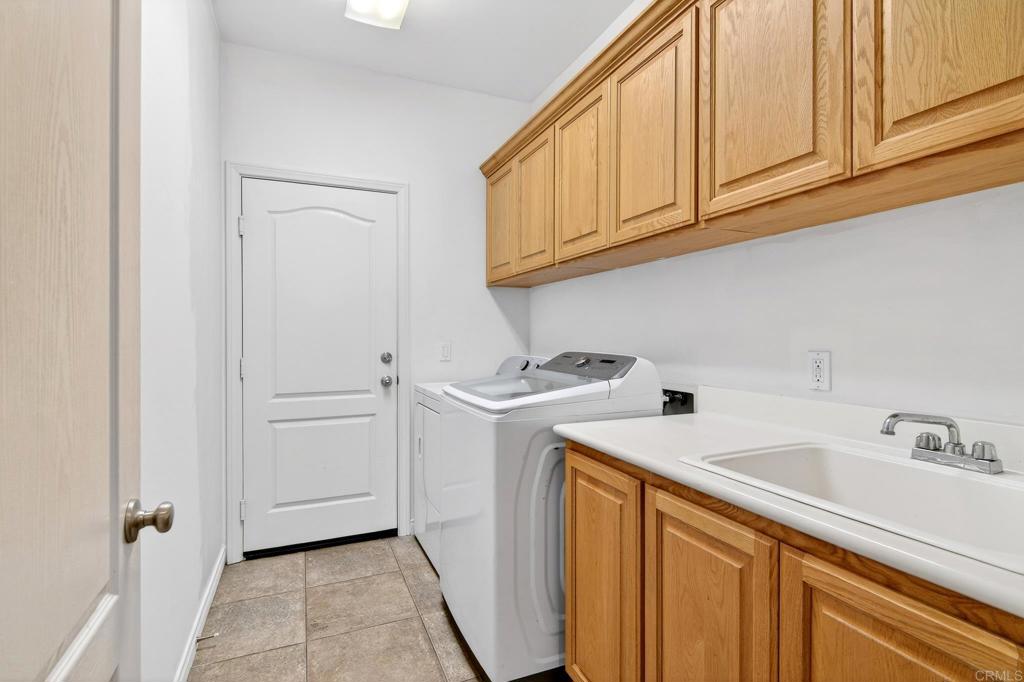 15953 Shalom Road Ramona, CA 92065 - Photo 41 of 71 a utility room with sink dryer and washer