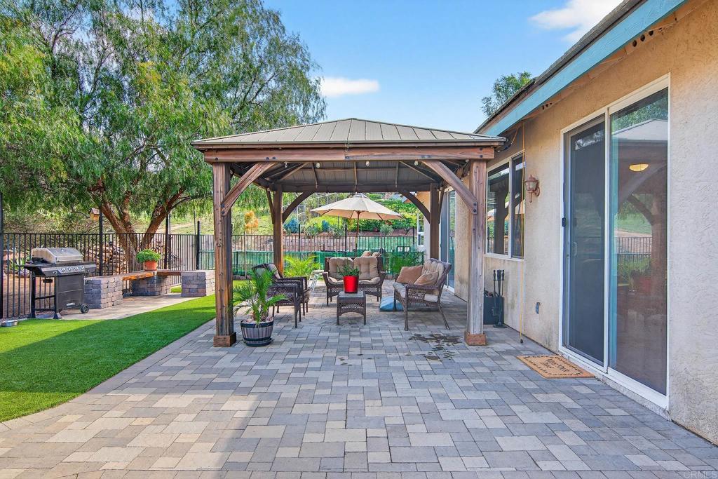 15953 Shalom Road Ramona, CA 92065 - Photo 43 of 71 a view of a porch with a table and chairs