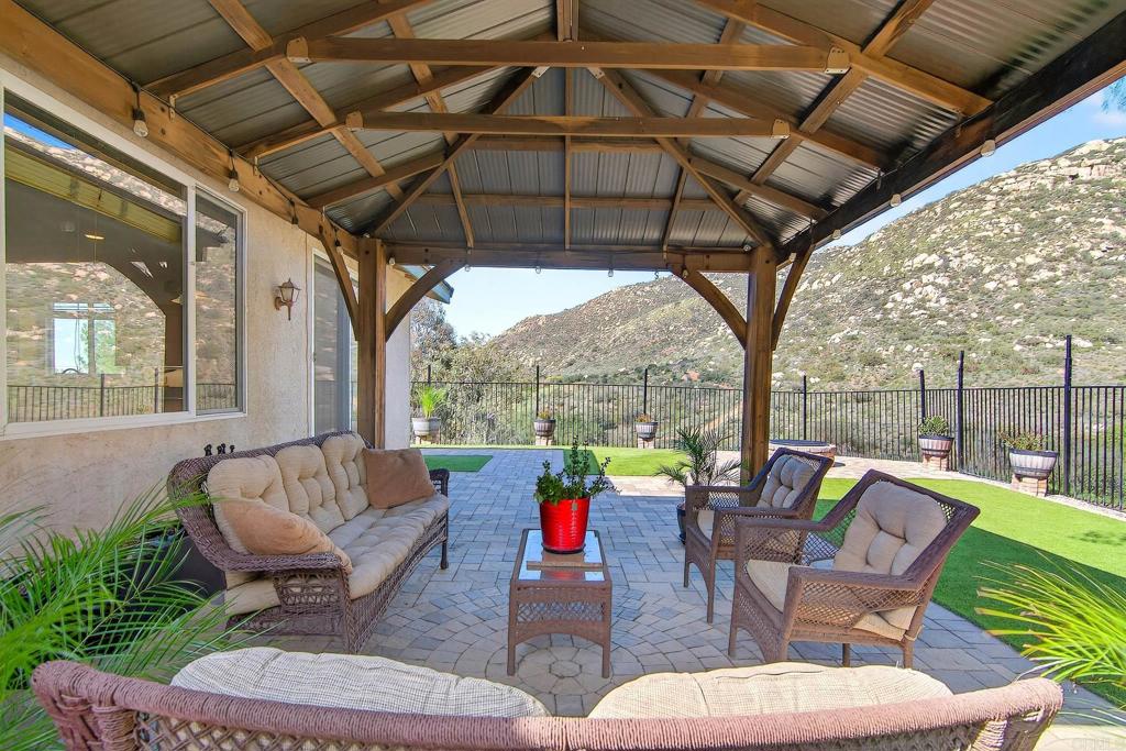 15953 Shalom Road Ramona, CA 92065 - Photo 49 of 71 a outdoor living space with patio furniture and garden view