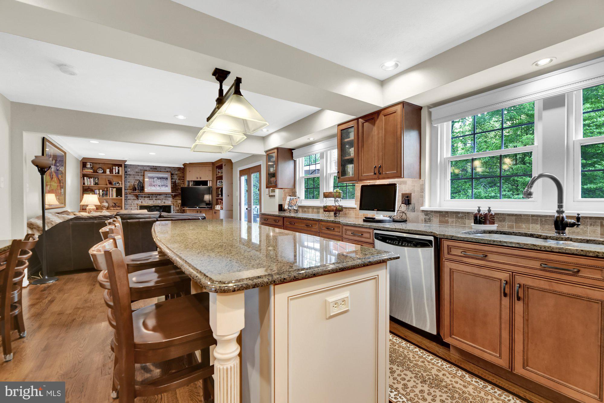 4 Boulder Brook Court Baltimore, MD 21209 - Photo 11 of 49 a kitchen with stainless steel appliances granite countertop a sink stove and cabinets