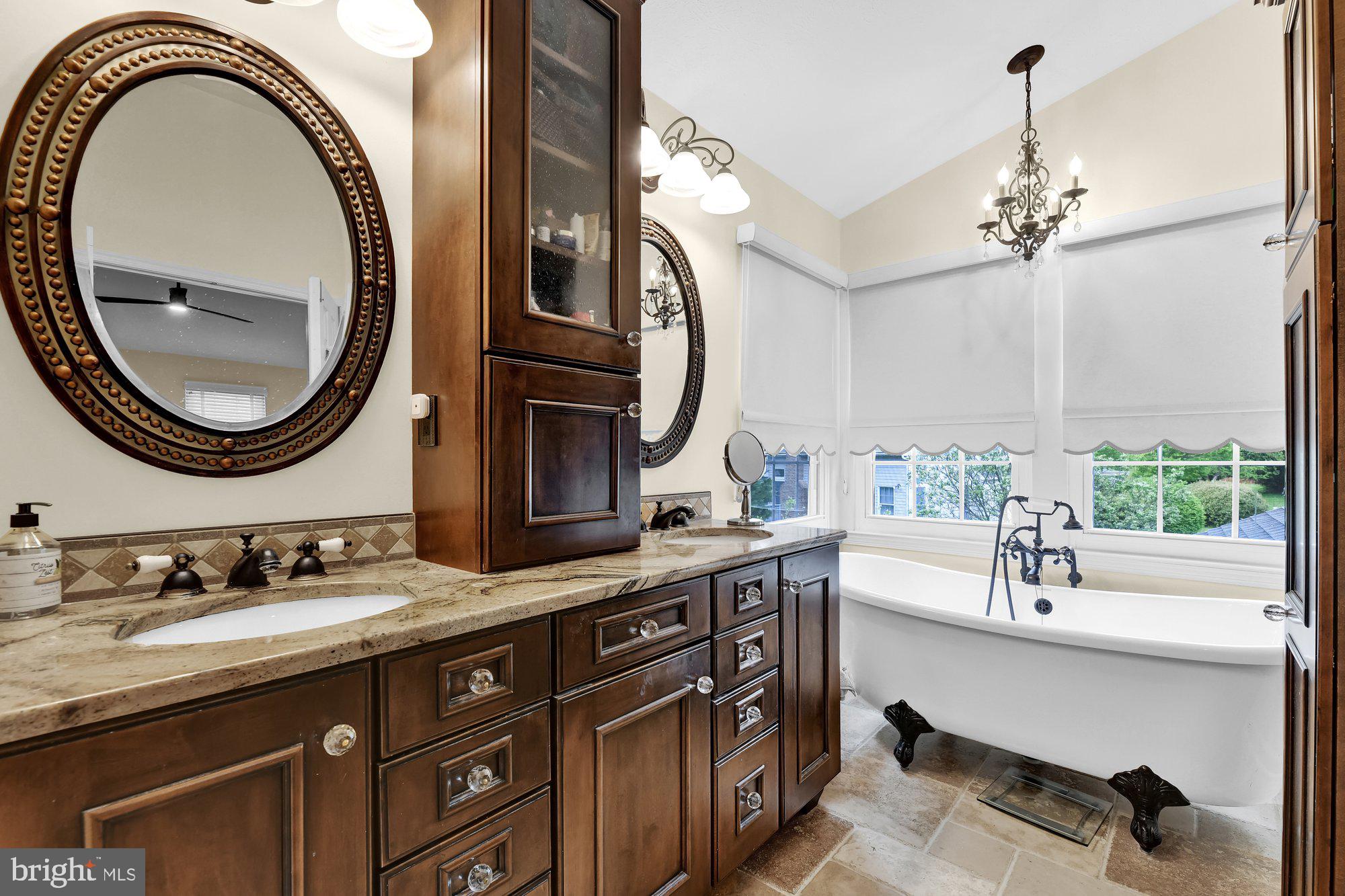 4 Boulder Brook Court Baltimore, MD 21209 - Photo 23 of 49 a bathroom with a double vanity sink and a mirror
