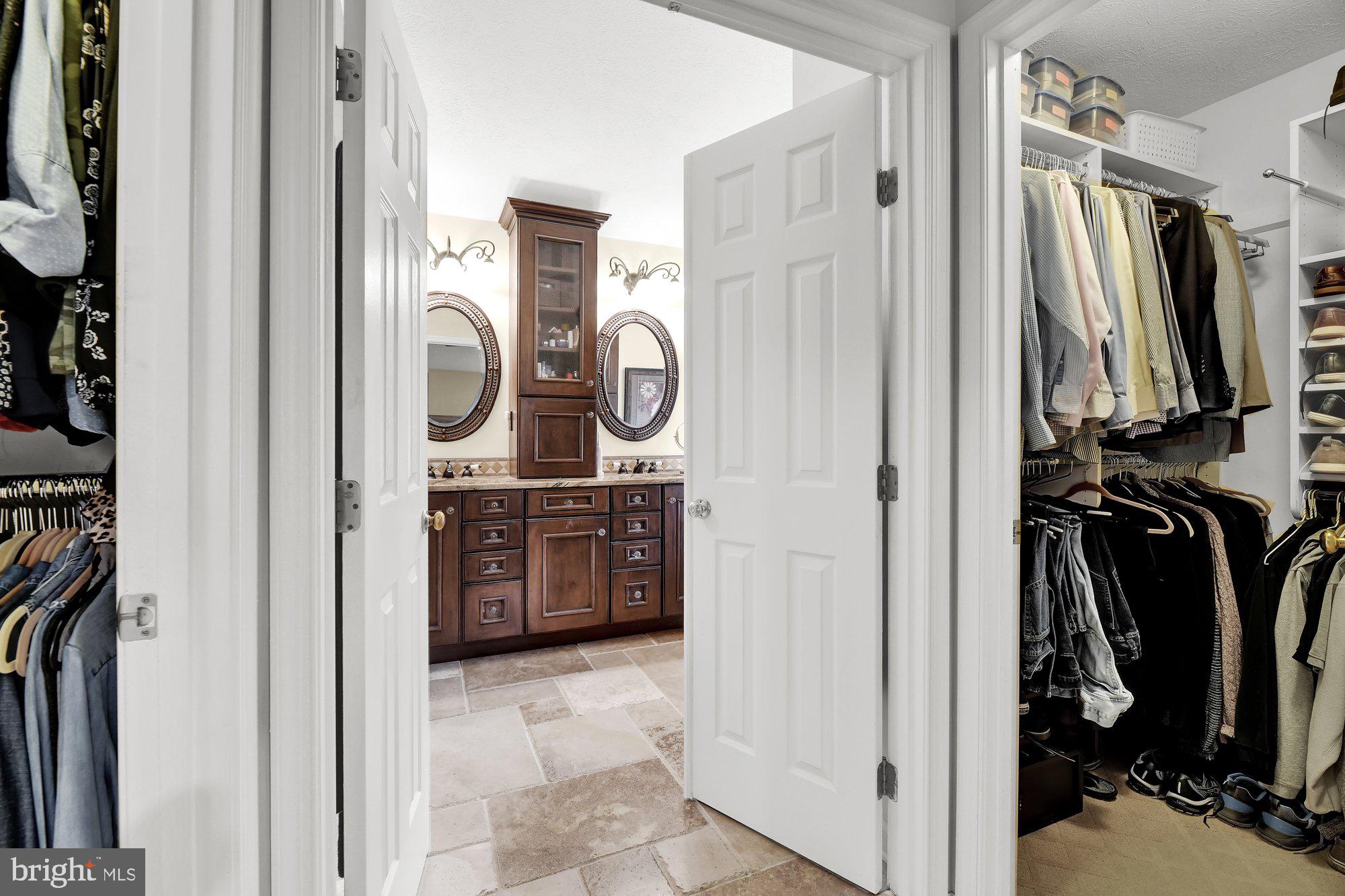 4 Boulder Brook Court Baltimore, MD 21209 - Photo 24 of 49 a view of walk in closet with clothes