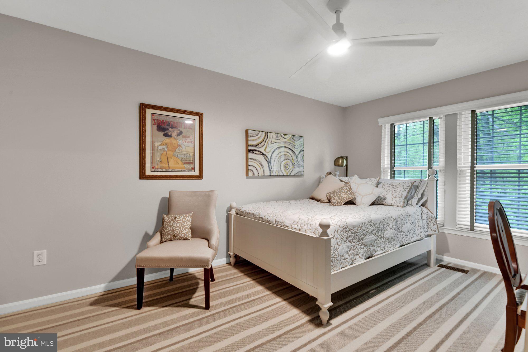4 Boulder Brook Court Baltimore, MD 21209 - Photo 26 of 49 a bedroom with a bed and wooden floor