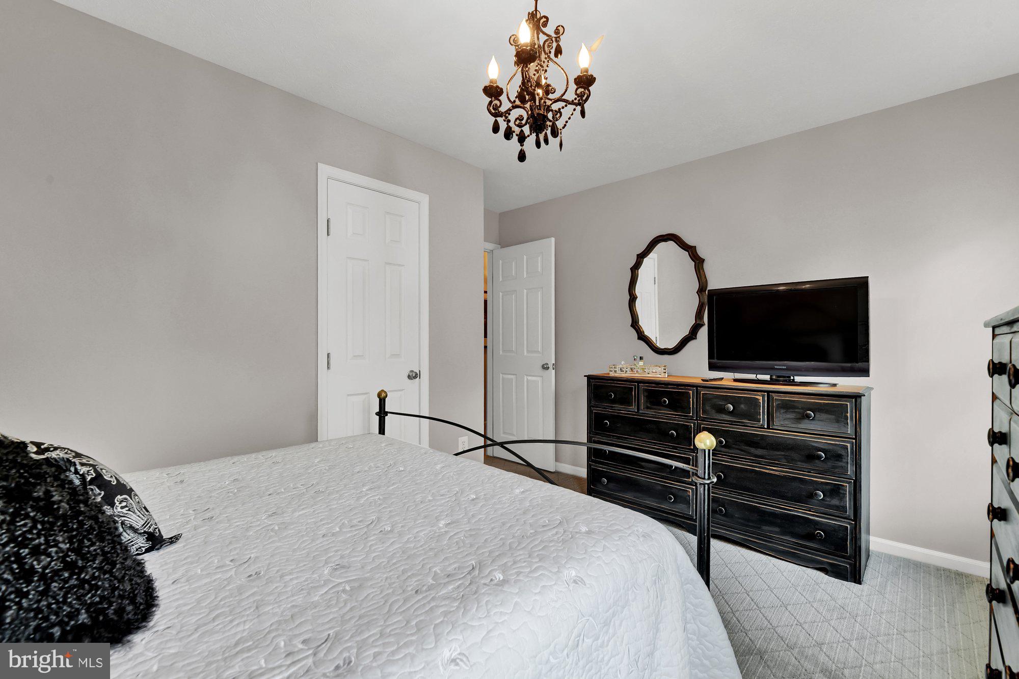 4 Boulder Brook Court Baltimore, MD 21209 - Photo 28 of 49 a bedroom with a bed and a flat screen tv