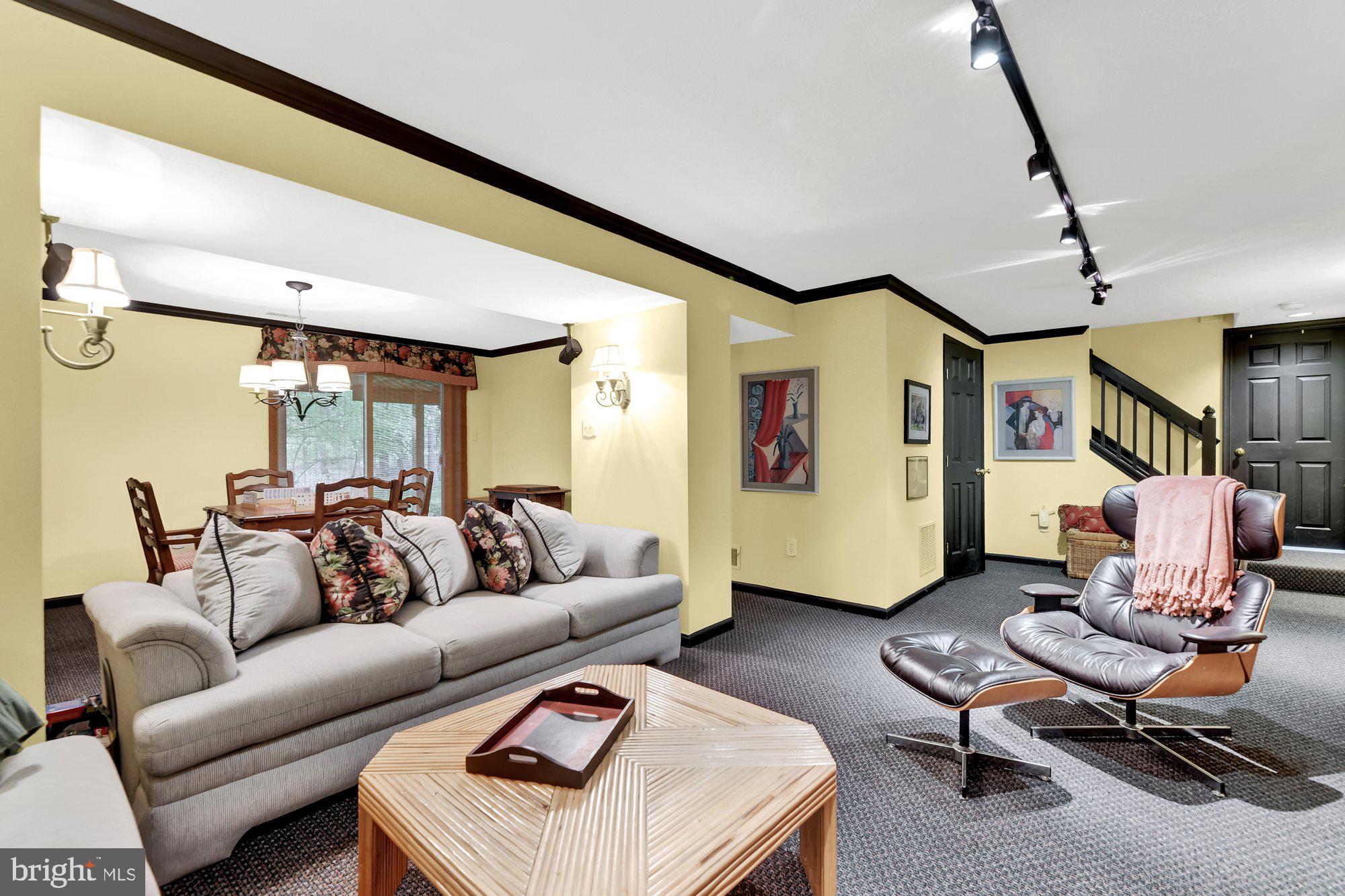 4 Boulder Brook Court Baltimore, MD 21209 - Photo 34 of 49 a living room with furniture and a flat screen tv