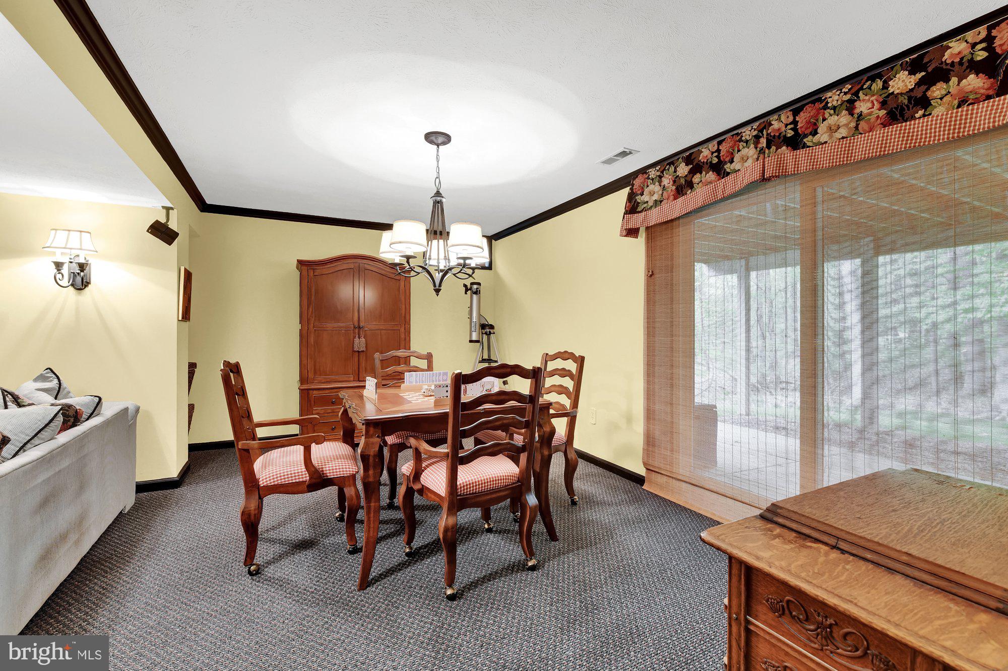 4 Boulder Brook Court Baltimore, MD 21209 - Photo 35 of 49 a view of a dining room with furniture window and outside view