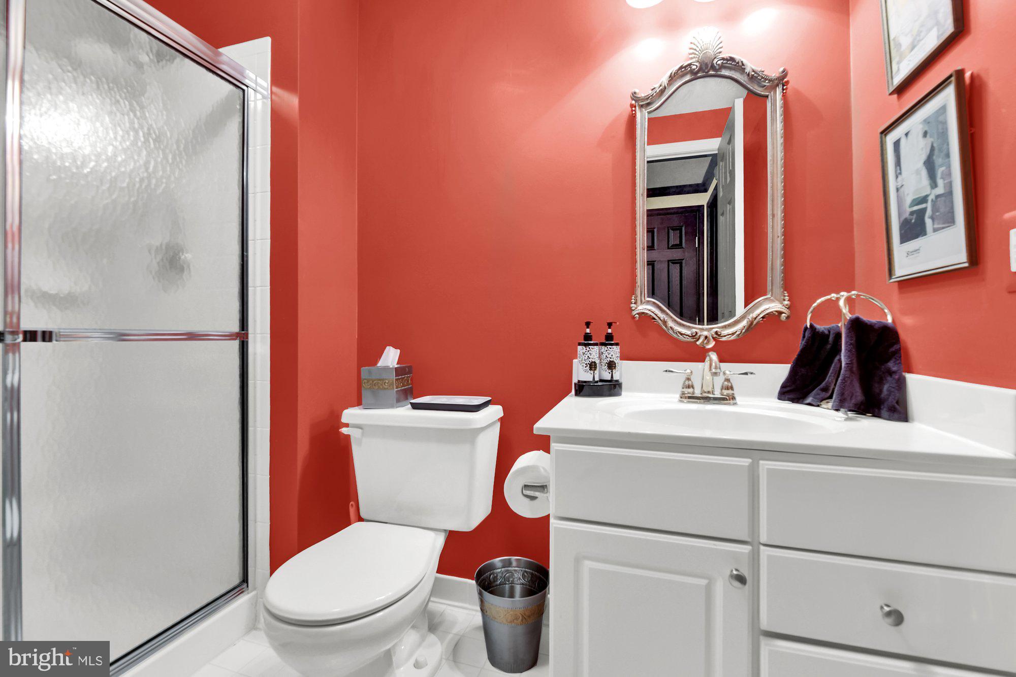 4 Boulder Brook Court Baltimore, MD 21209 - Photo 37 of 49 a bathroom with a toilet sink and mirror