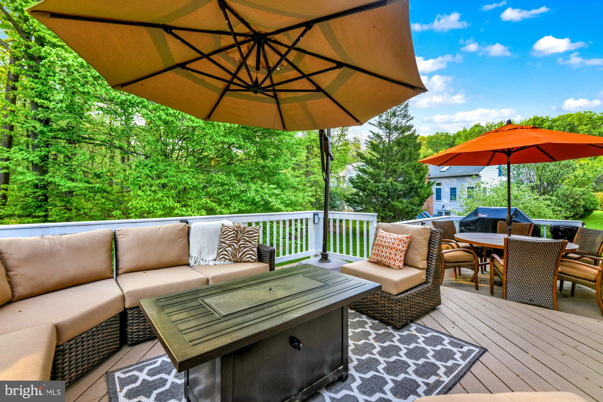4 Boulder Brook Court Baltimore, MD 21209 - Photo 40 of 49 a view of a patio with a table and chairs under an umbrella