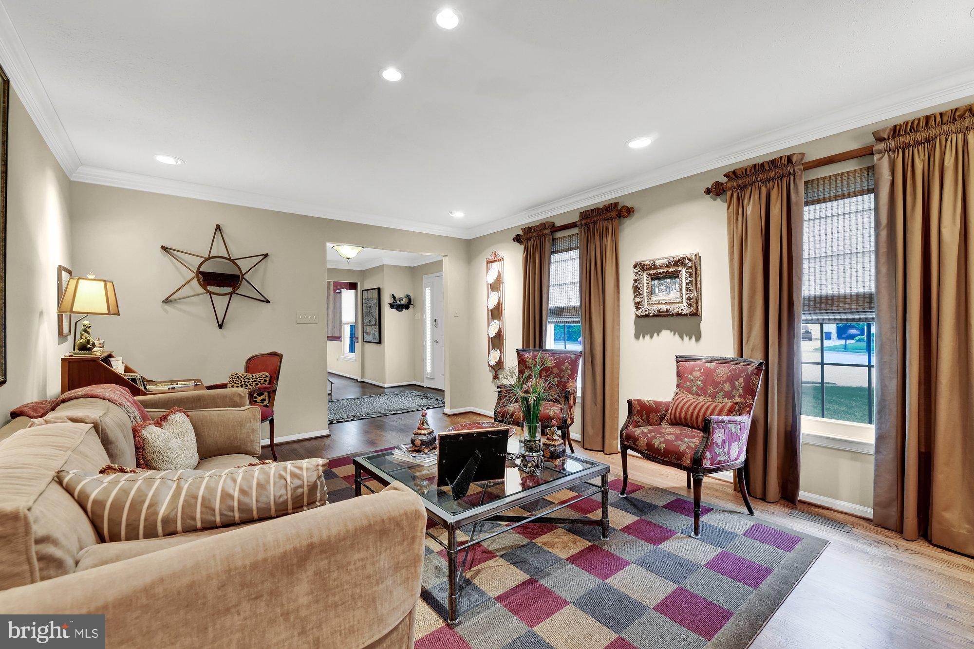 4 Boulder Brook Court Baltimore, MD 21209 - Photo 7 of 49 a living room with furniture a rug and a floor to ceiling window