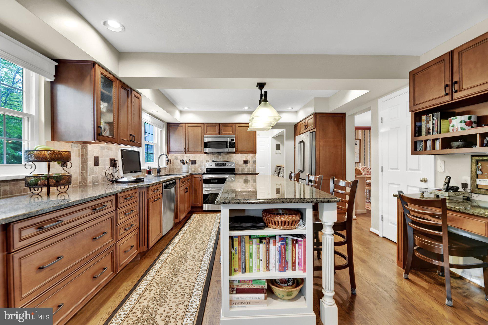 4 Boulder Brook Court Baltimore, MD 21209 - Photo 8 of 49 a kitchen with lots of wooden furniture cabinets and appliances