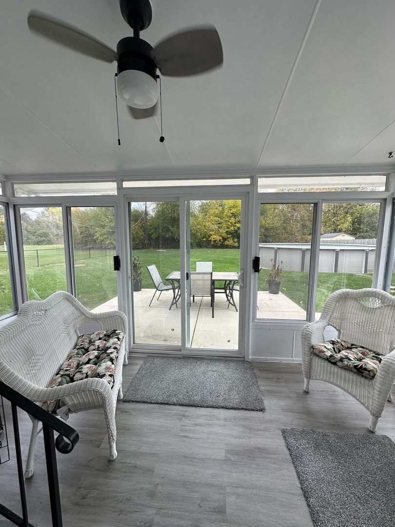 2315 Nan Street Aurora, IL 60502 - Photo 12 of 14 a living room with hardwood floor and a large window