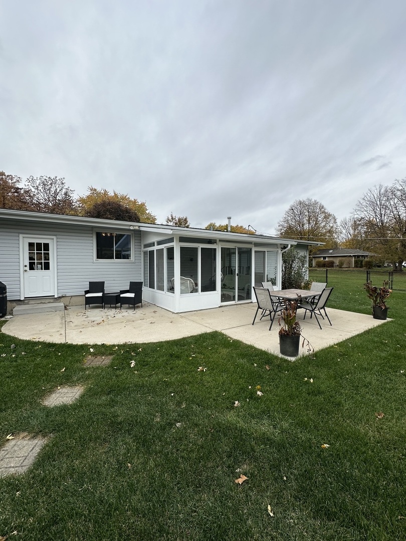 2315 Nan Street Aurora, IL 60502 - Photo 13 of 14 a view of a house with swimming pool and sitting area