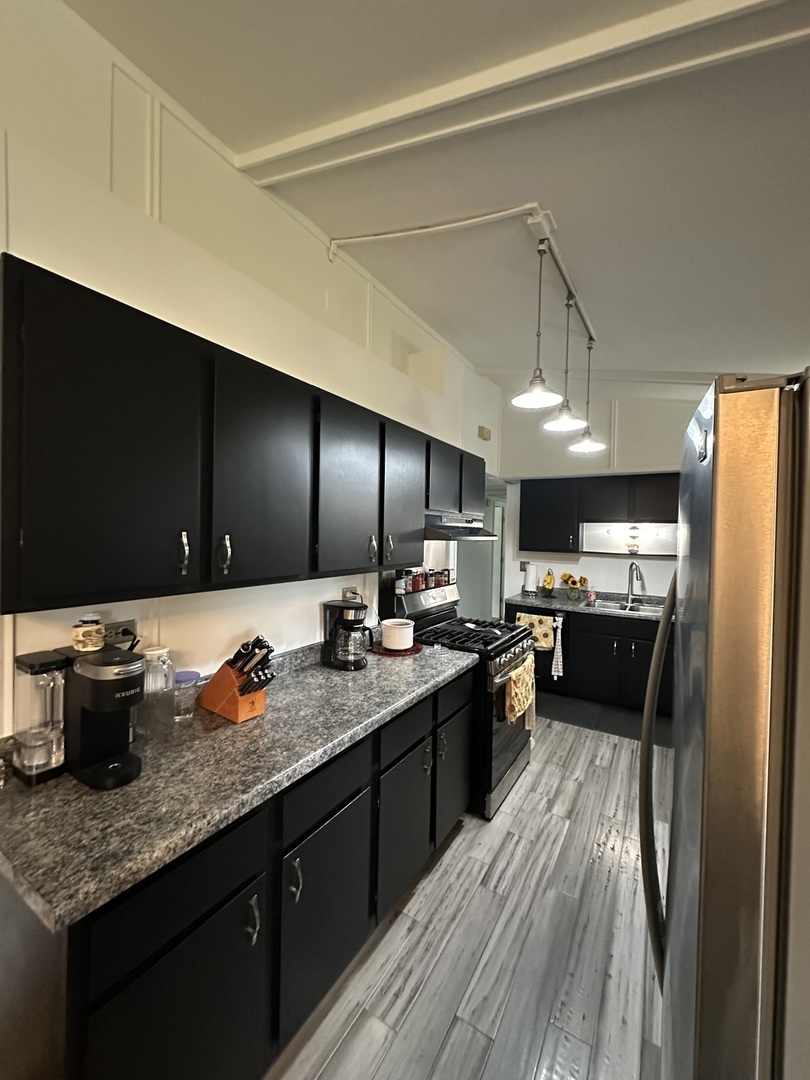 2315 Nan Street Aurora, IL 60502 - Photo 4 of 14 a kitchen with a sink dishwasher stove and refrigerator