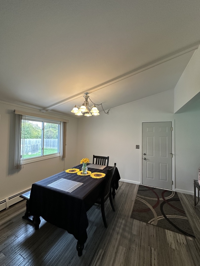 2315 Nan Street Aurora, IL 60502 - Photo 6 of 14 a bedroom with a bed and wooden floor