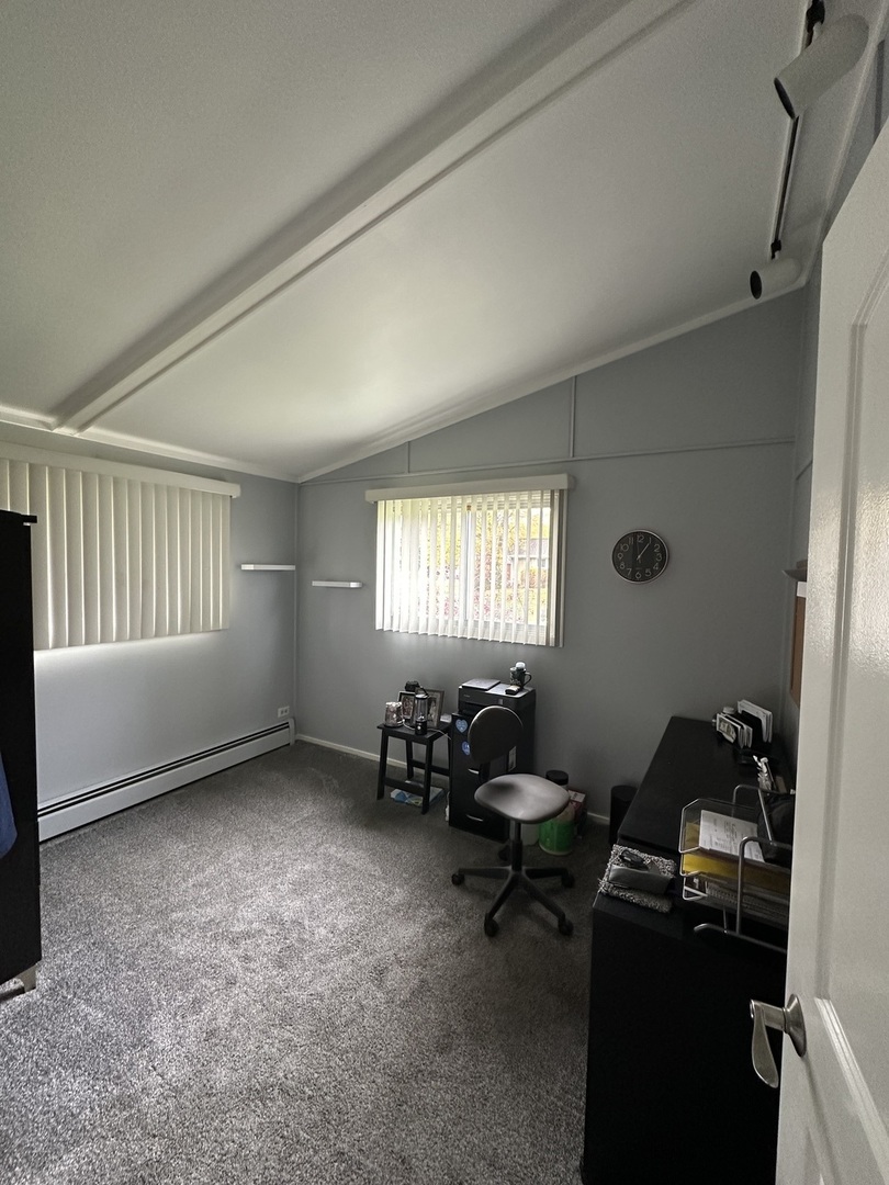 2315 Nan Street Aurora, IL 60502 - Photo 9 of 14 a livingroom with workspace and a window