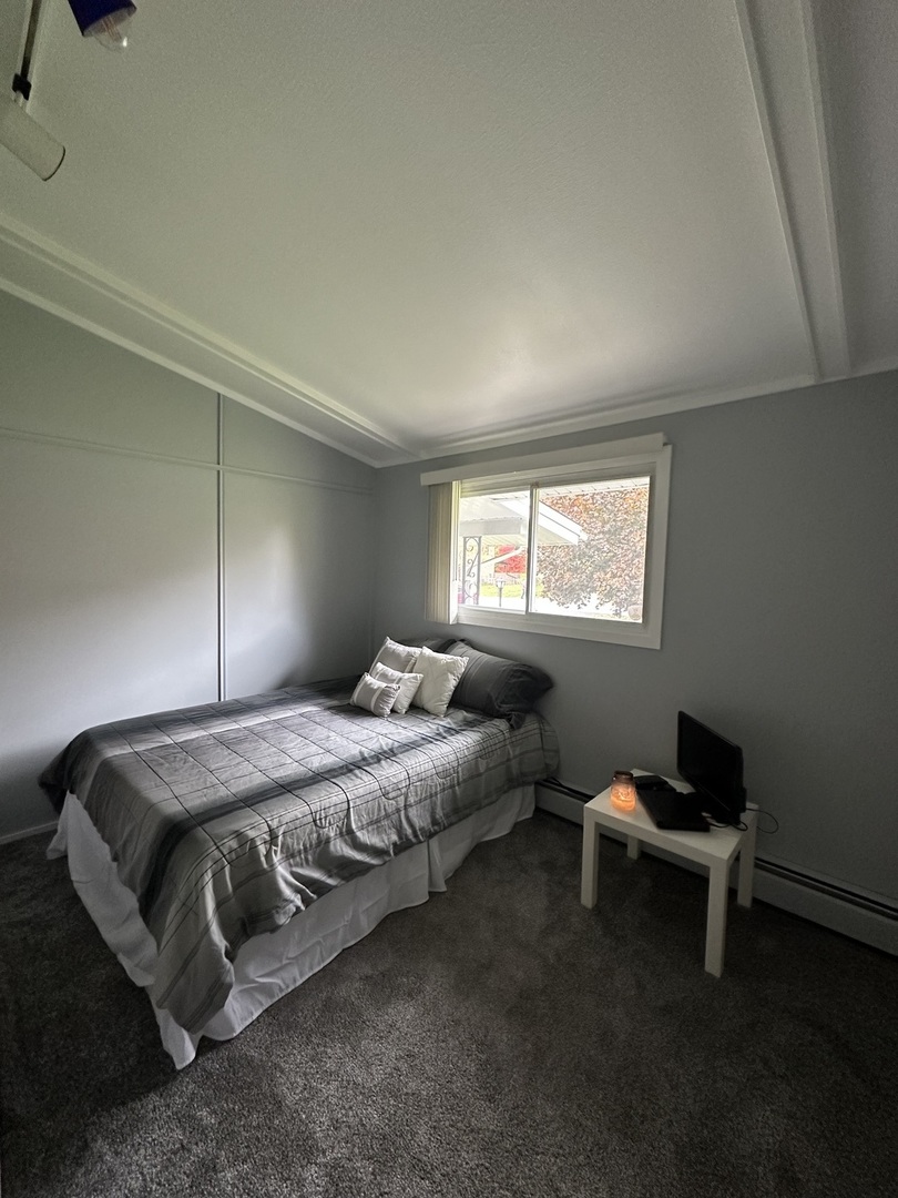 2315 Nan Street Aurora, IL 60502 - Photo 10 of 14 a bedroom with a bed and a window