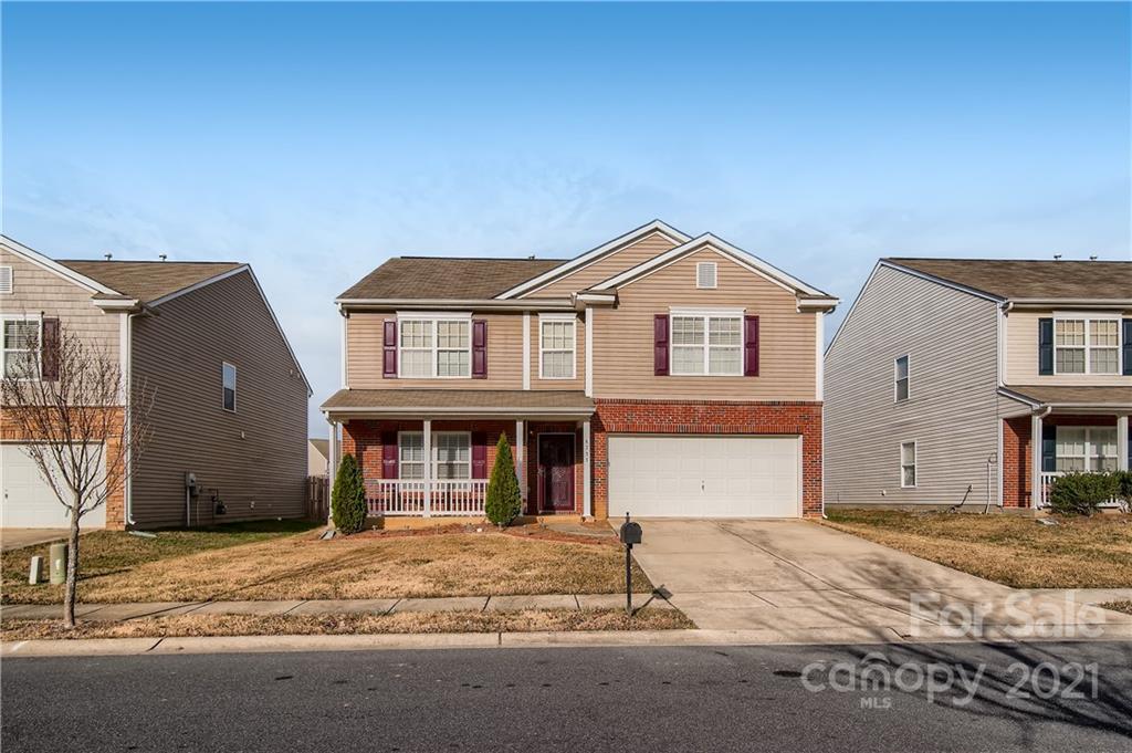 8735 Chalkstone Road Charlotte, NC 28216 - Photo 2 of 29 a front view of a house with garden