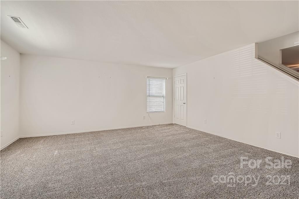 8735 Chalkstone Road Charlotte, NC 28216 - Photo 13 of 29 a view of an empty room and window