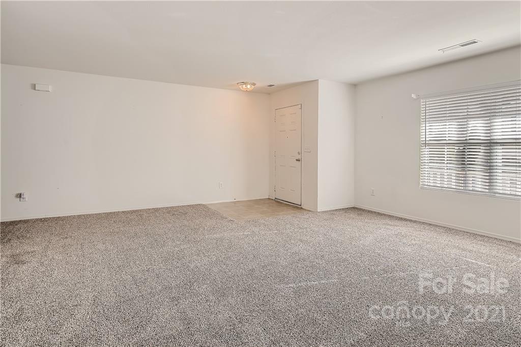 8735 Chalkstone Road Charlotte, NC 28216 - Photo 14 of 29 a view of an empty room with a window