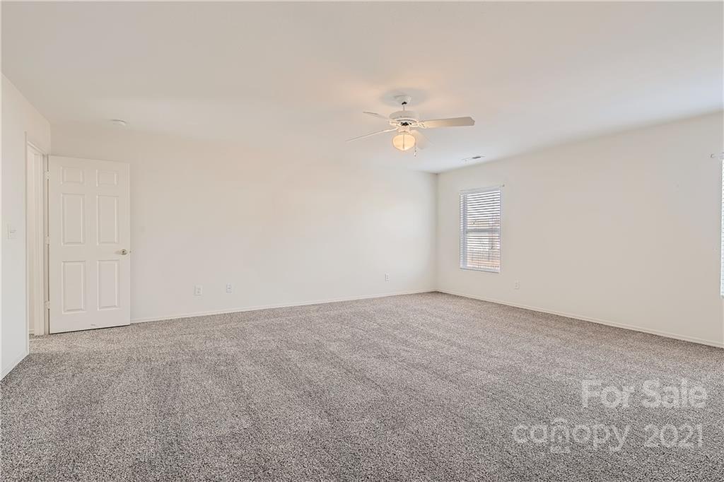8735 Chalkstone Road Charlotte, NC 28216 - Photo 17 of 29 a view of an empty room with a bathroom