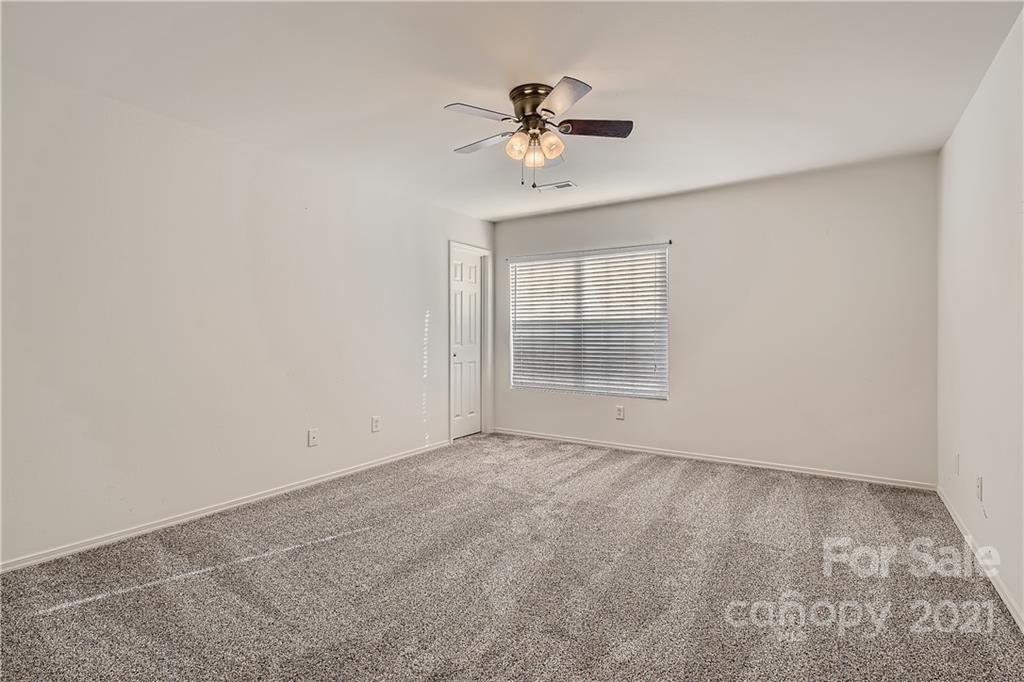 8735 Chalkstone Road Charlotte, NC 28216 - Photo 19 of 29 a view of an empty room with a window